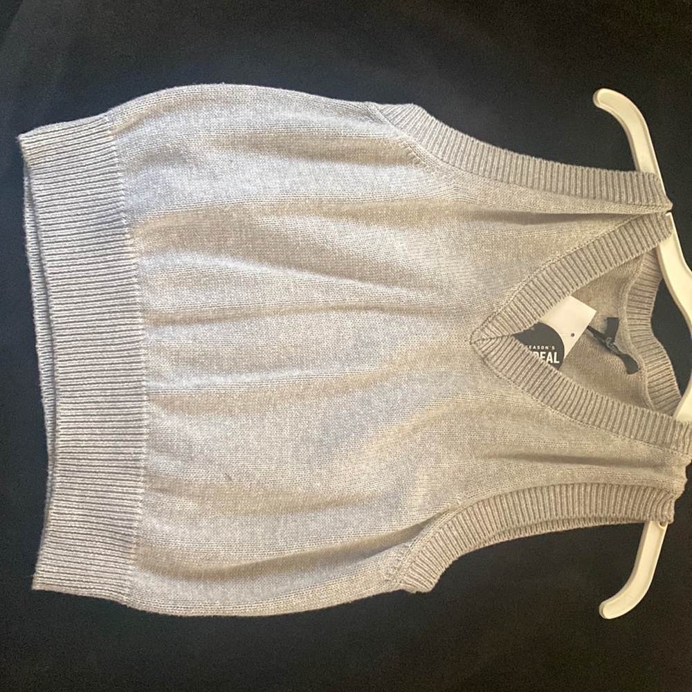 A grey sweater vest, it’s never been used. Paid $15 but selling it for $10